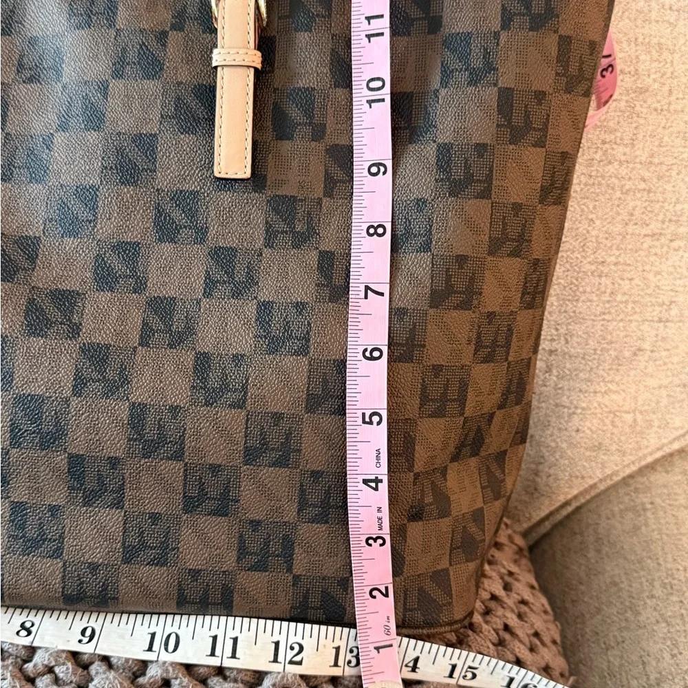 MICHAEL Michael Kors Jet Set travel tote in a brown checkered monogram pattern. - Picture 6 of 10